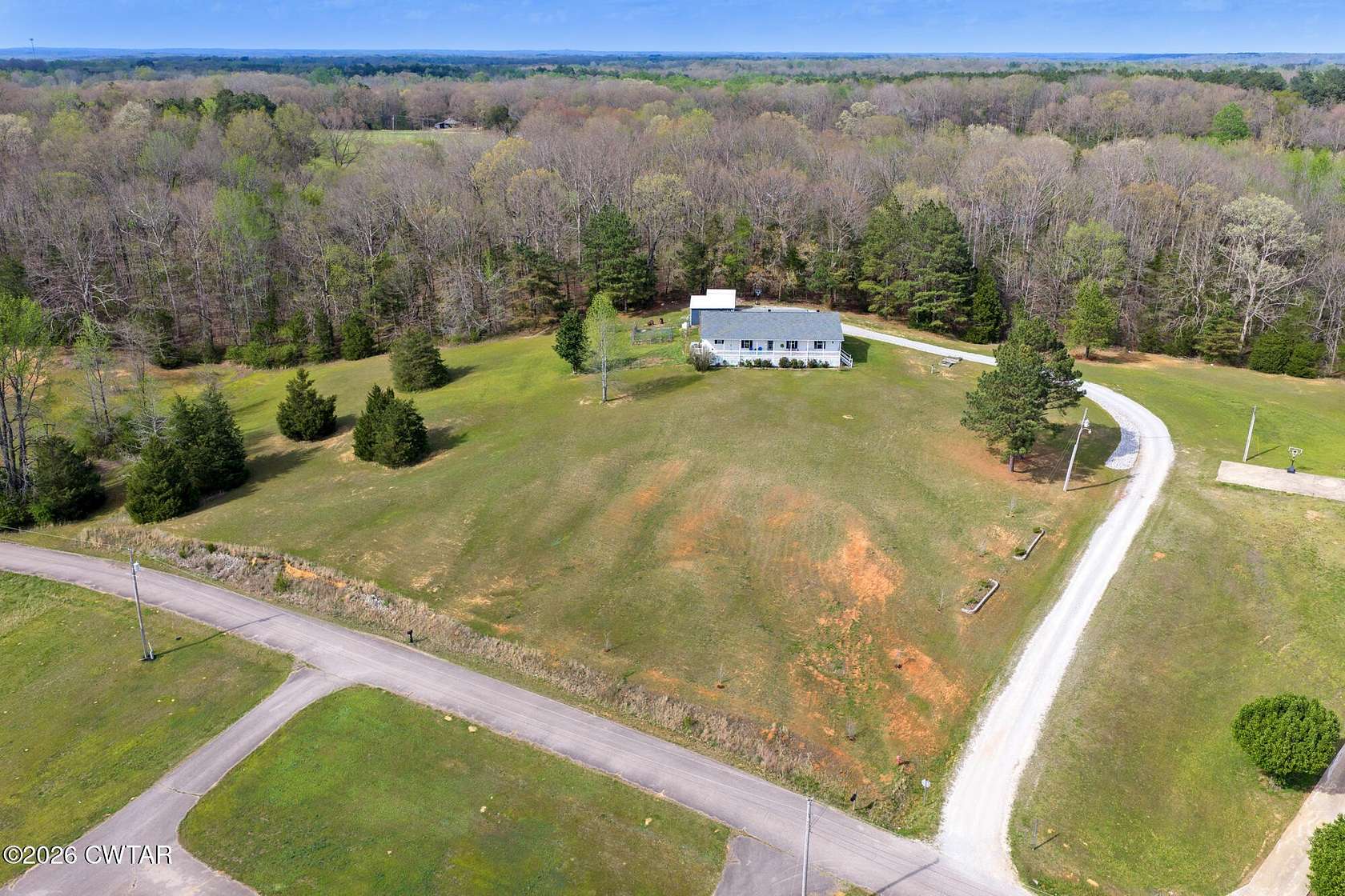 4.74 Acres of Land with Home for Sale in Scotts Hill, Tennessee