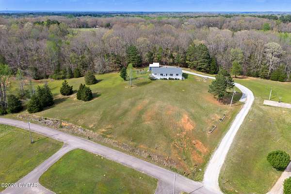 4.74 Acres of Land with Home for Sale in Scotts Hill, Tennessee
