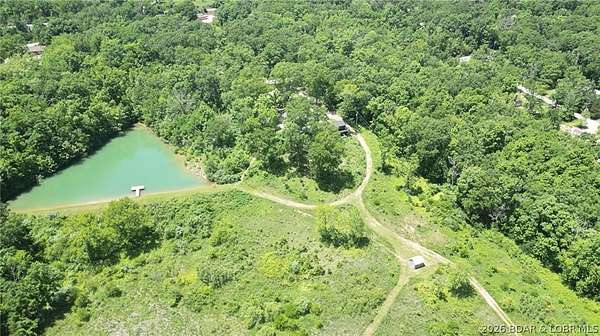 60 Acres of Agricultural Land with Home for Sale in Eldon, Missouri