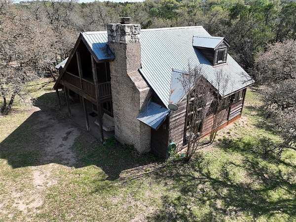 6.89 Acres of Land with Home for Sale in Spicewood, Texas
