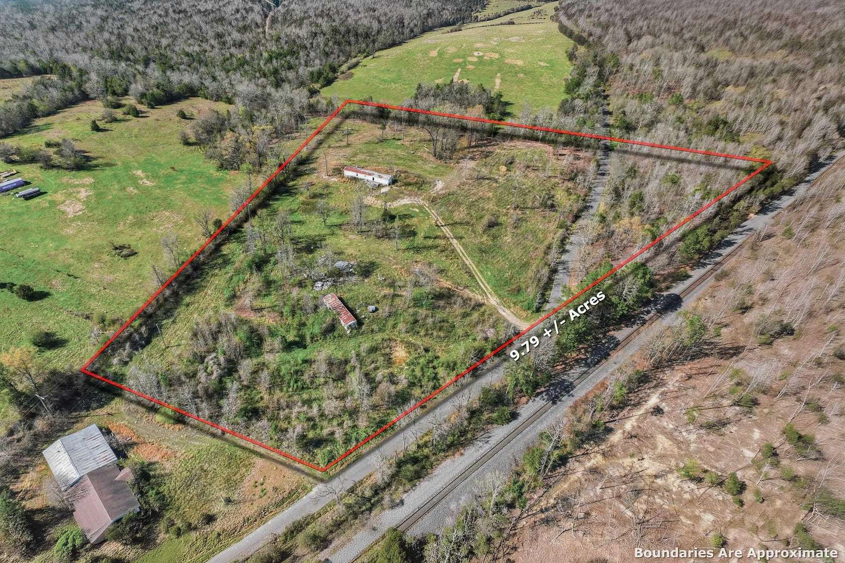 9.79 Acres of Land with Home for Sale in Grannis, Arkansas