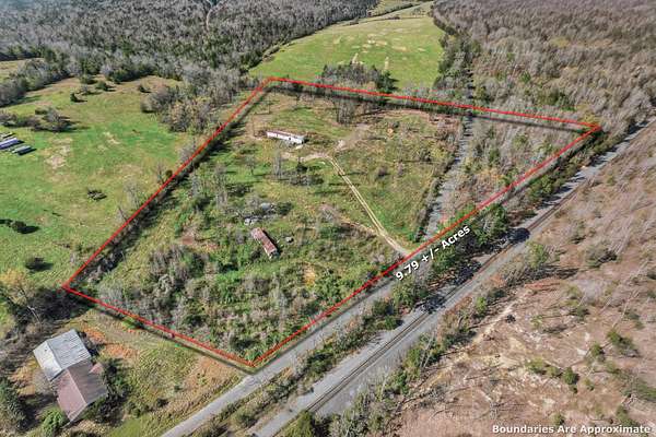 9.79 Acres of Land with Home for Sale in Grannis, Arkansas