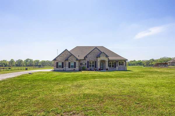 1.5 Acres of Land with Home for Sale in Farmersville, Texas