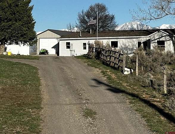 30 Acres of Land with Home for Sale in Hotchkiss, Colorado
