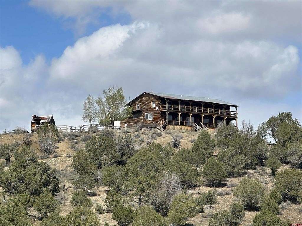 9.7 Acres of Land with Home for Sale in Crawford, Colorado