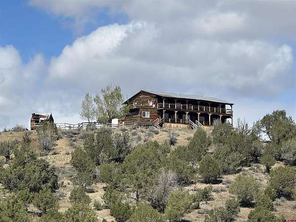 9.7 Acres of Land with Home for Sale in Crawford, Colorado