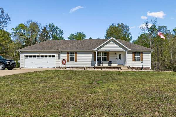 5 Acres of Land with Home for Sale in Charlotte, Tennessee