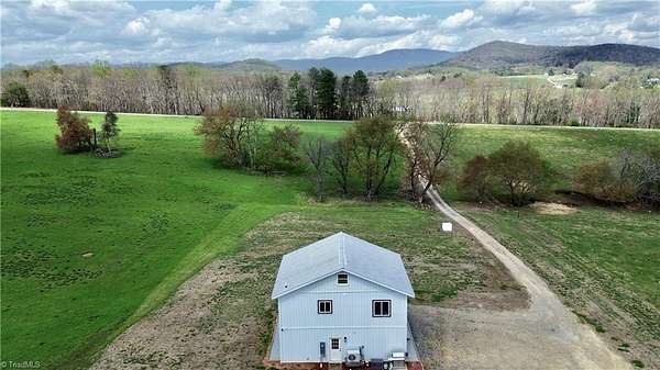 11.2 Acres of Land with Home for Sale in Elkin, North Carolina