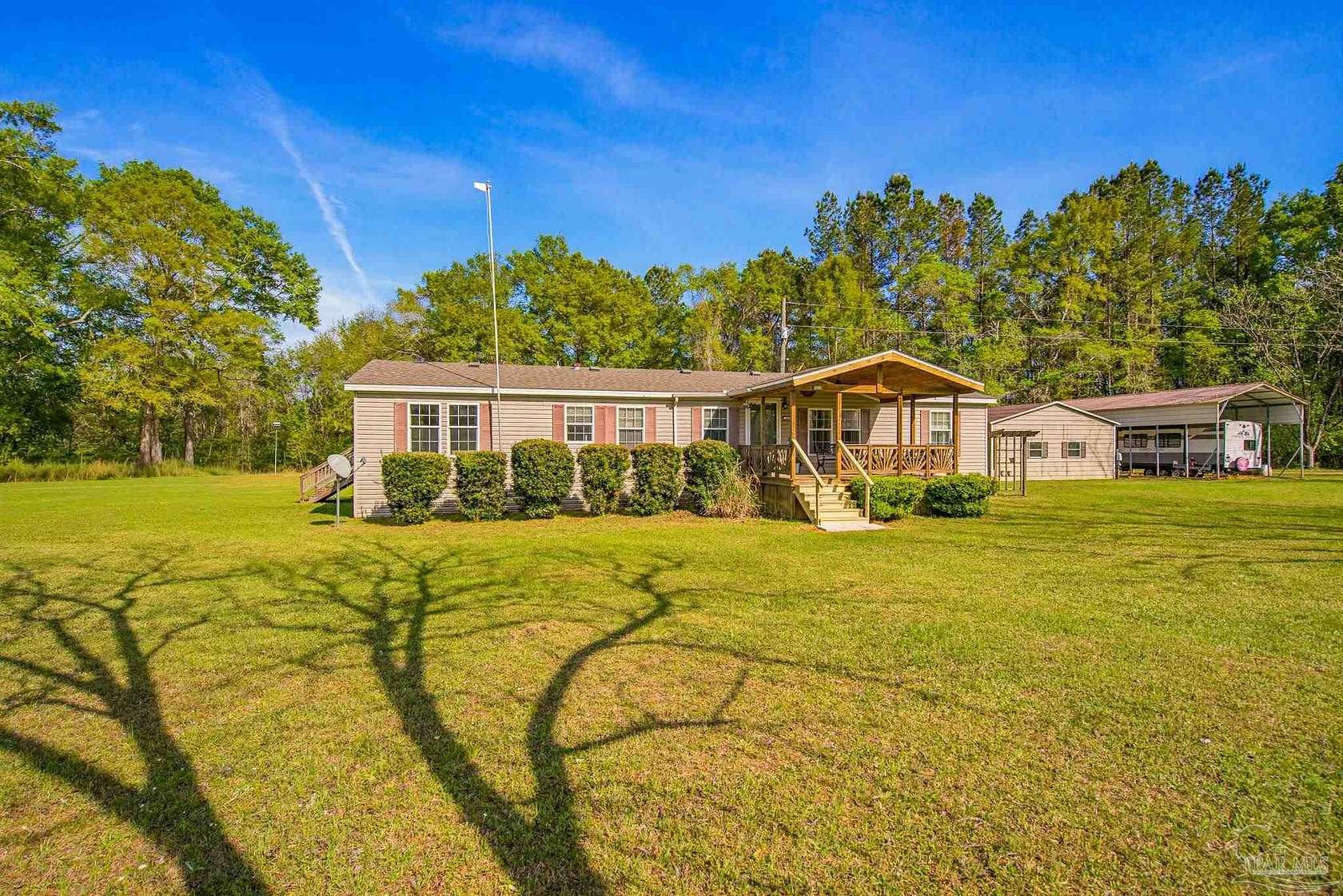 10.3 Acres of Recreational Land with Home for Sale in Munson, Florida