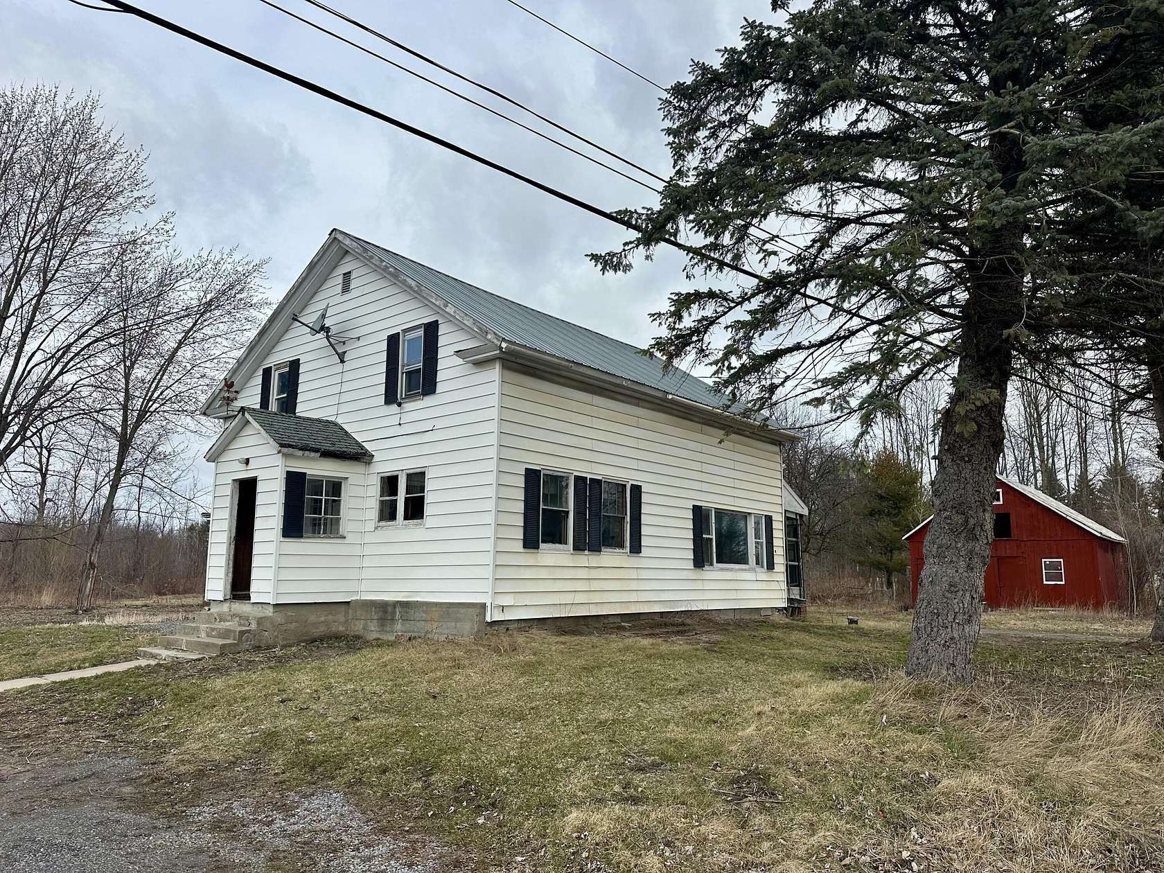 27.3 Acres of Land with Home for Sale in Peru, New York