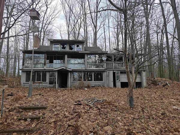 20 Acres of Recreational Land with Home for Sale in Harrison, Michigan