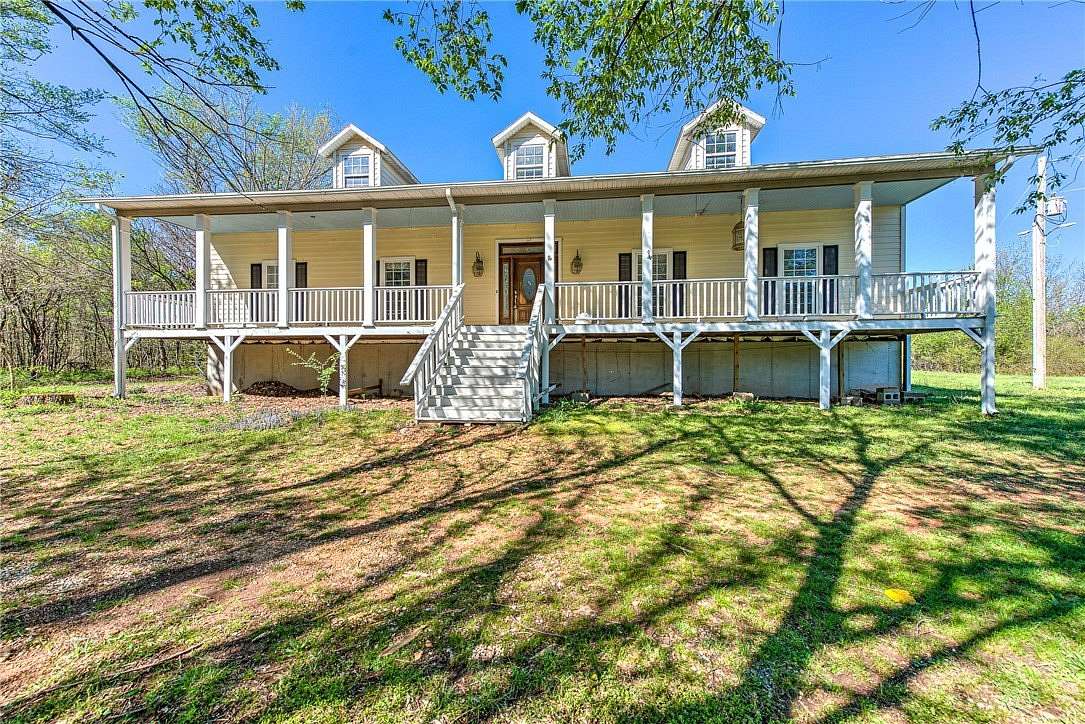 18.2 Acres of Land with Home for Sale in Gravette, Arkansas