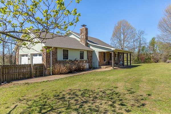 8.4 Acres of Land with Home for Sale in Gravette, Arkansas