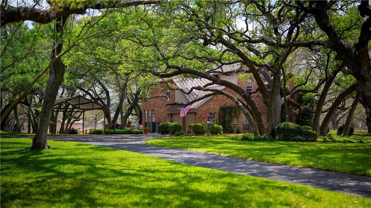 7.36 Acres of Land with Home for Sale in Floresville, Texas