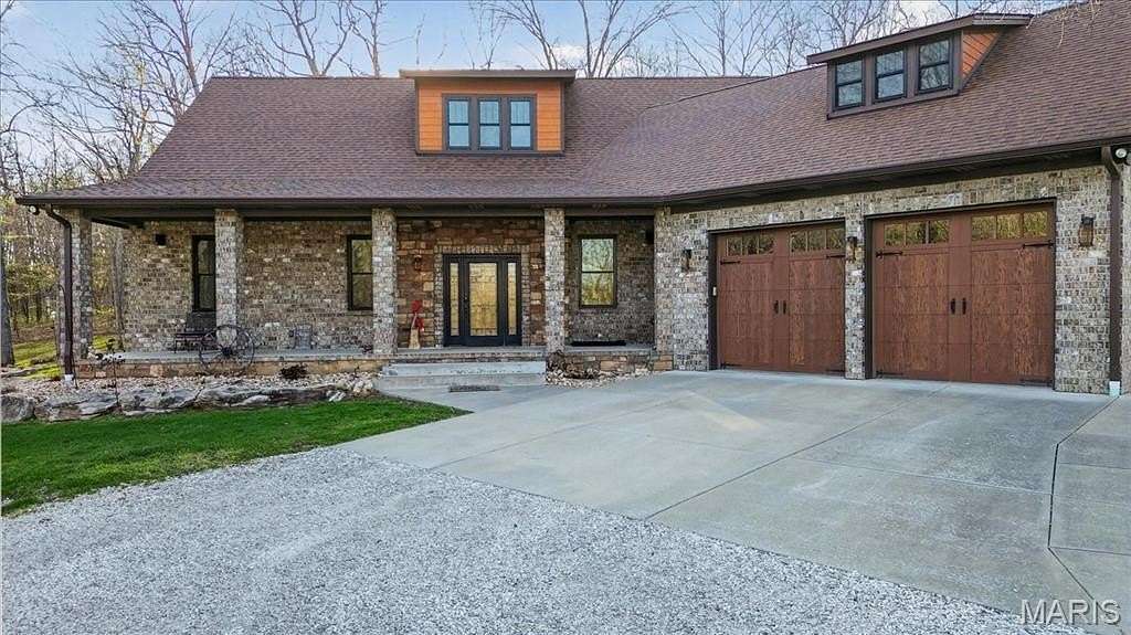 23.4 Acres of Land with Home for Sale in Hawk Point, Missouri