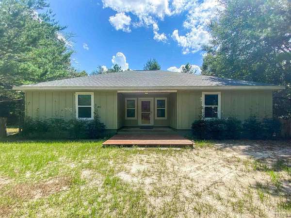 4.78 Acres of Land with Home for Sale in Milton, Florida