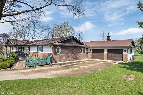 1.5 Acres of Land with Home for Sale in Louisville, Ohio