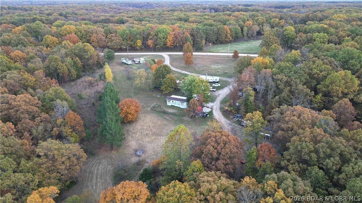 8.7 Acres of Land with Home for Sale in Stover, Missouri
