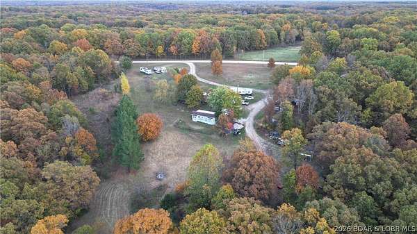 8.7 Acres of Land with Home for Sale in Stover, Missouri