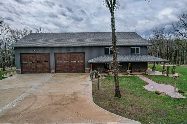 194 Acres of Land with Home for Sale in Cross Timbers, Missouri