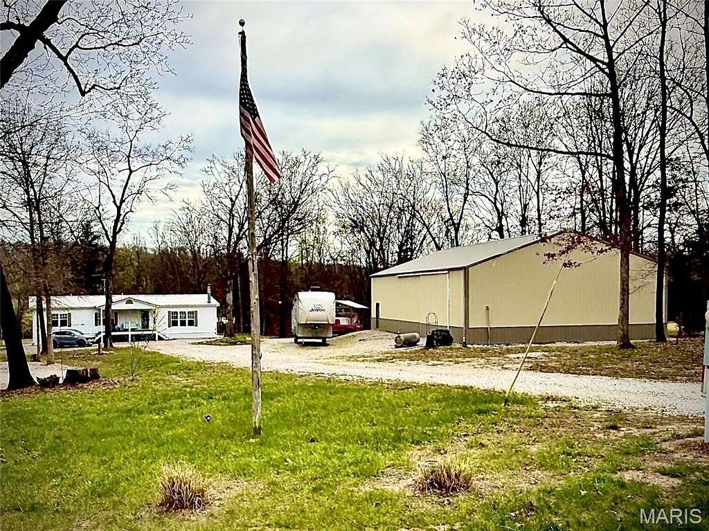 5.56 Acres of Land with Home for Sale in Monroe City, Missouri