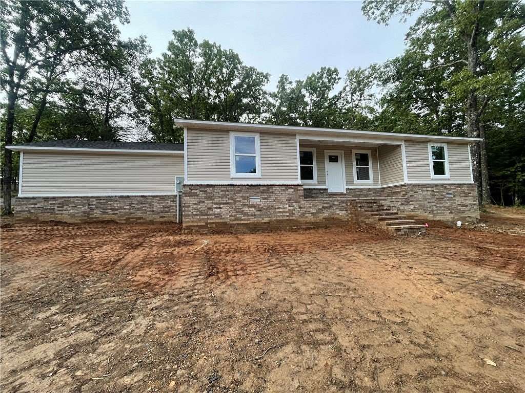 1.63 Acres of Land with Home for Sale in Clarksville, Arkansas