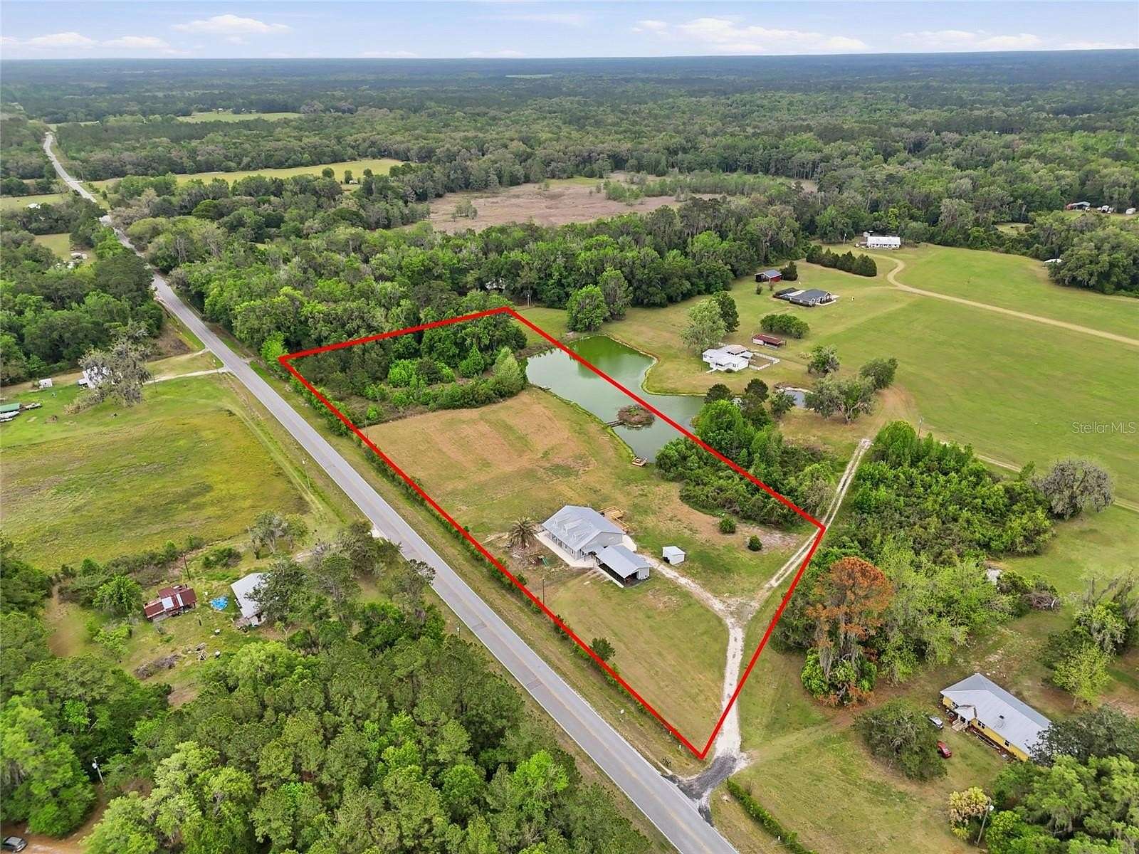 5.6 Acres of Land with Home for Sale in Gainesville, Florida