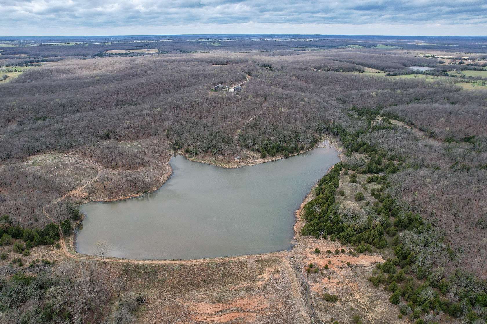 196 Acres of Land with Home for Sale in Cross Timbers, Missouri