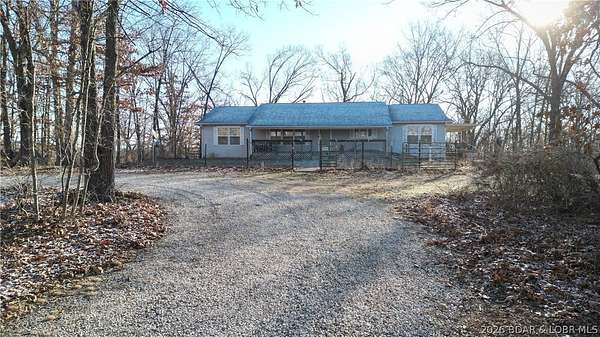 97 Acres of Recreational Land with Home for Sale in Stover, Missouri
