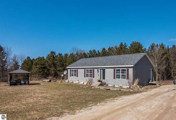 1.79 Acres of Land with Home for Sale in Rapid City, Michigan