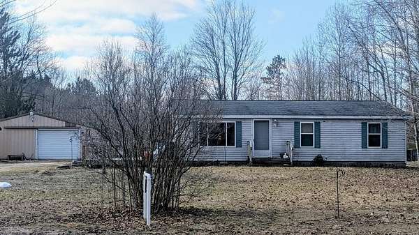 5 Acres of Land with Home for Sale in Thompsonville, Michigan