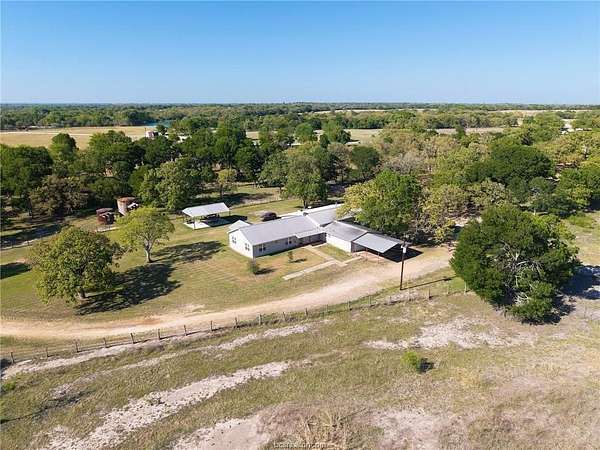 69.2 Acres of Agricultural Land with Home for Sale in Caldwell, Texas