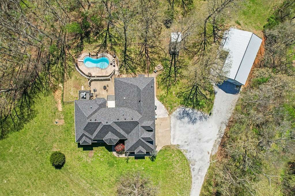 7.6 Acres of Land with Home for Sale in Gravette, Arkansas