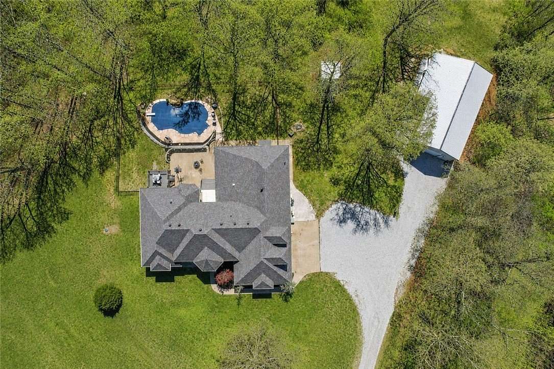 7.6 Acres of Land with Home for Sale in Gravette, Arkansas