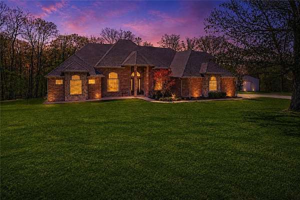7.6 Acres of Land with Home for Sale in Gravette, Arkansas