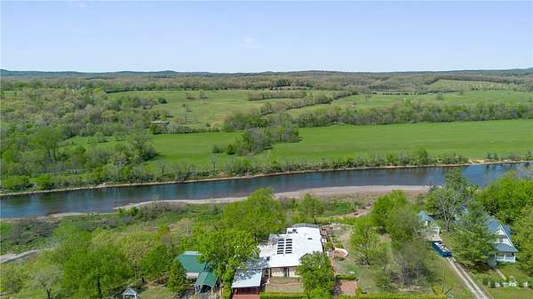 5.62 Acres of Land with Home for Sale in Cotter, Arkansas