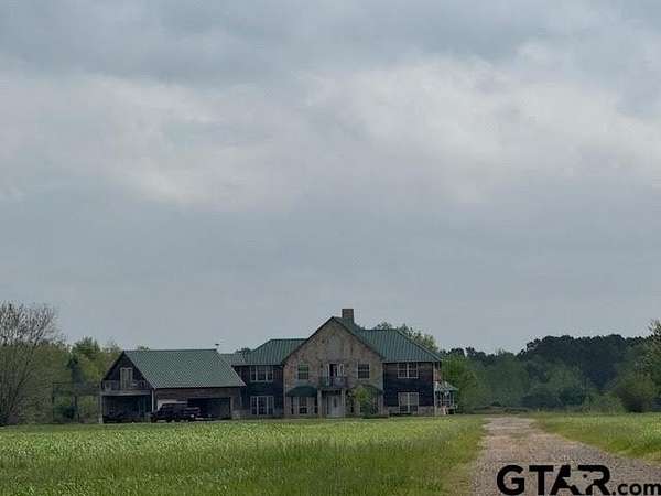 75.2 Acres of Land with Home for Sale in Ore City, Texas