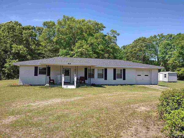 11.5 Acres of Land with Home for Sale in McDavid, Florida