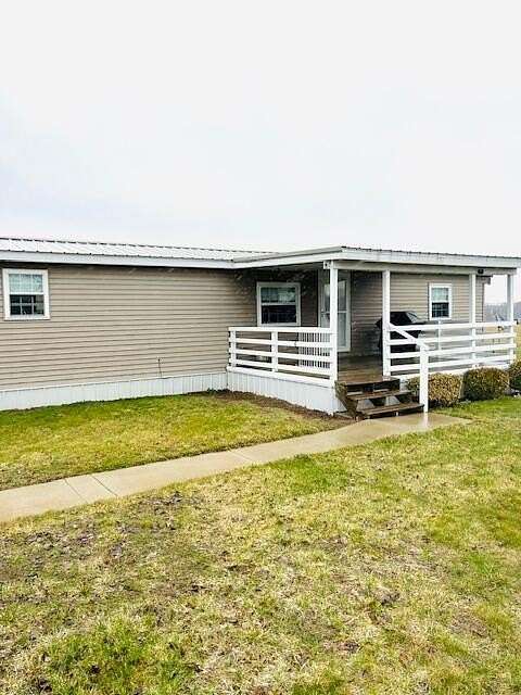 2 Acres of Land with Home for Sale in Stanwood, Michigan