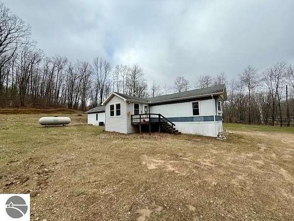 3.12 Acres of Land with Home for Sale in Harrison, Michigan