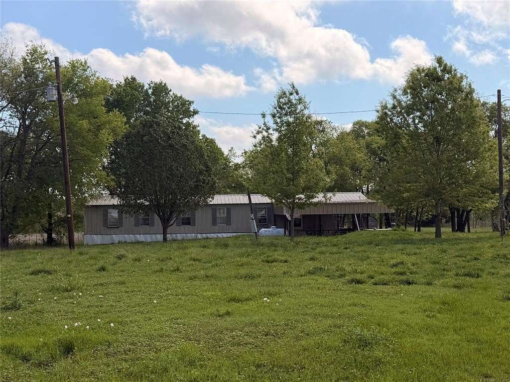 6.16 Acres of Land with Home for Sale in Paris, Texas