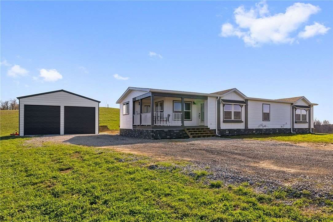 18.4 Acres of Land with Home for Sale in West Finley, Pennsylvania