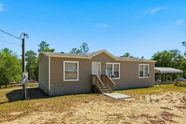2.5 Acres of Land with Home for Sale in Bronson, Florida