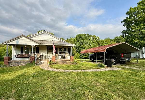 8.2 Acres of Land with Home for Sale in Big Sandy, Tennessee