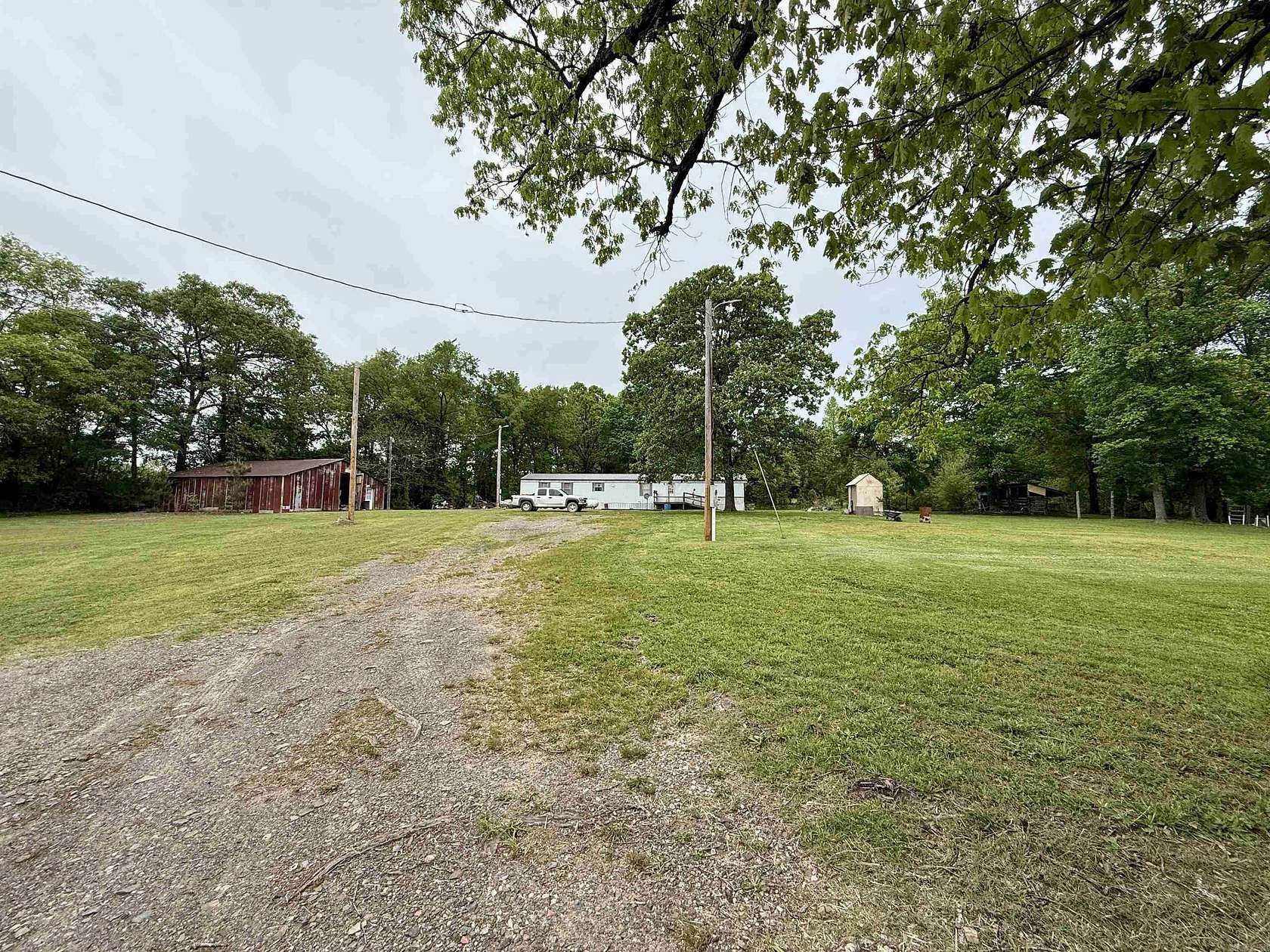 2.14 Acres of Land with Home for Sale in Cove, Arkansas