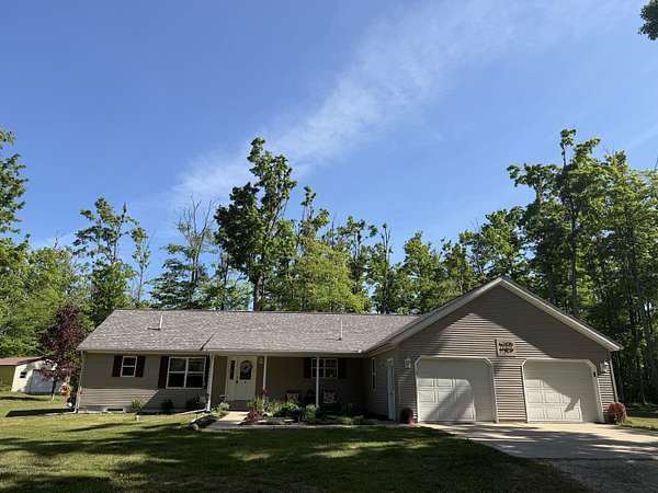 10 Acres of Recreational Land with Home for Sale in Elmira, Michigan