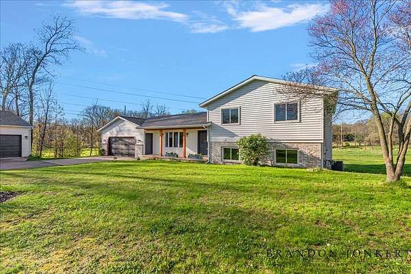 4 Acres of Land with Home for Sale in Alto, Michigan