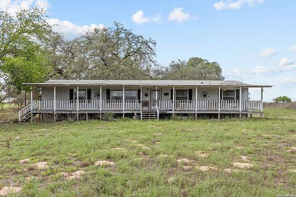 10 Acres of Land with Home for Sale in Floresville, Texas