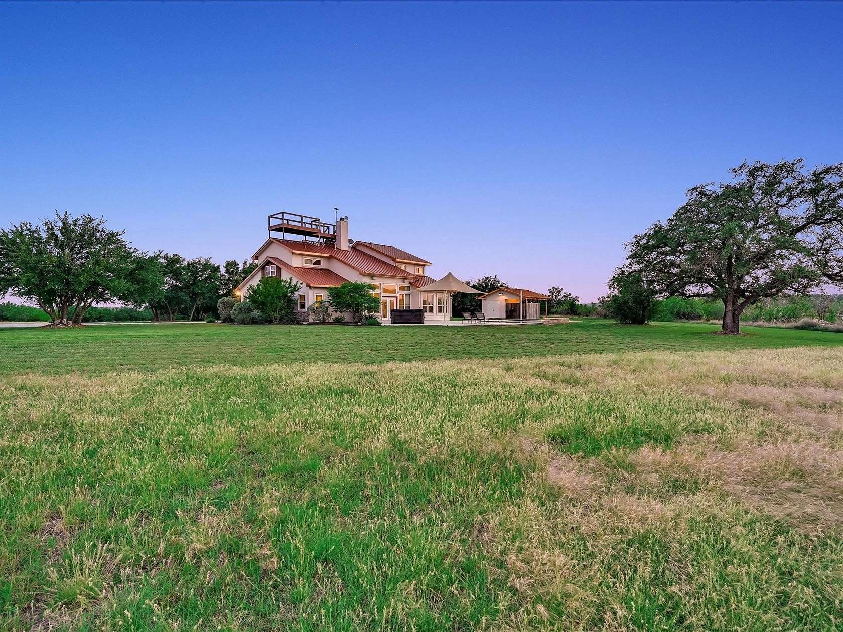 10.9 Acres of Land with Home for Sale in Spicewood, Texas