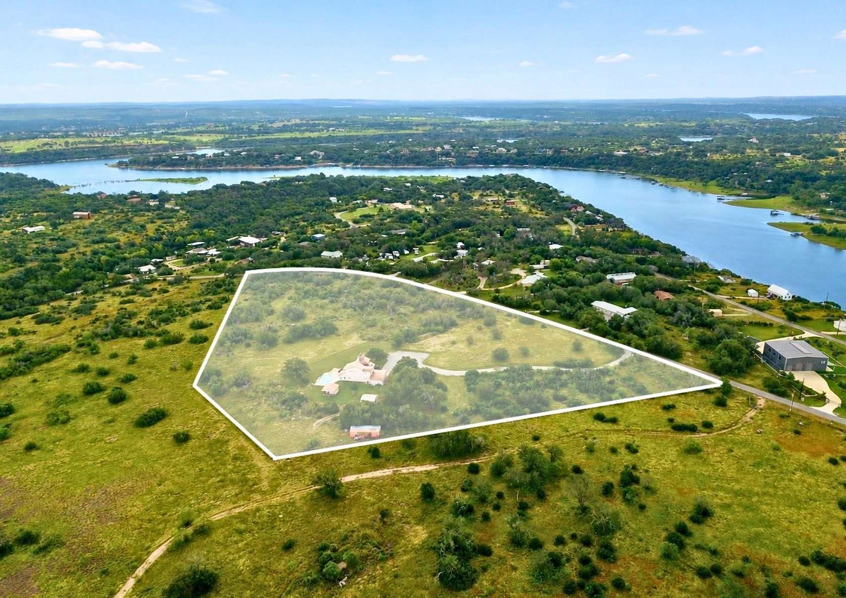 10.9 Acres of Land with Home for Sale in Spicewood, Texas